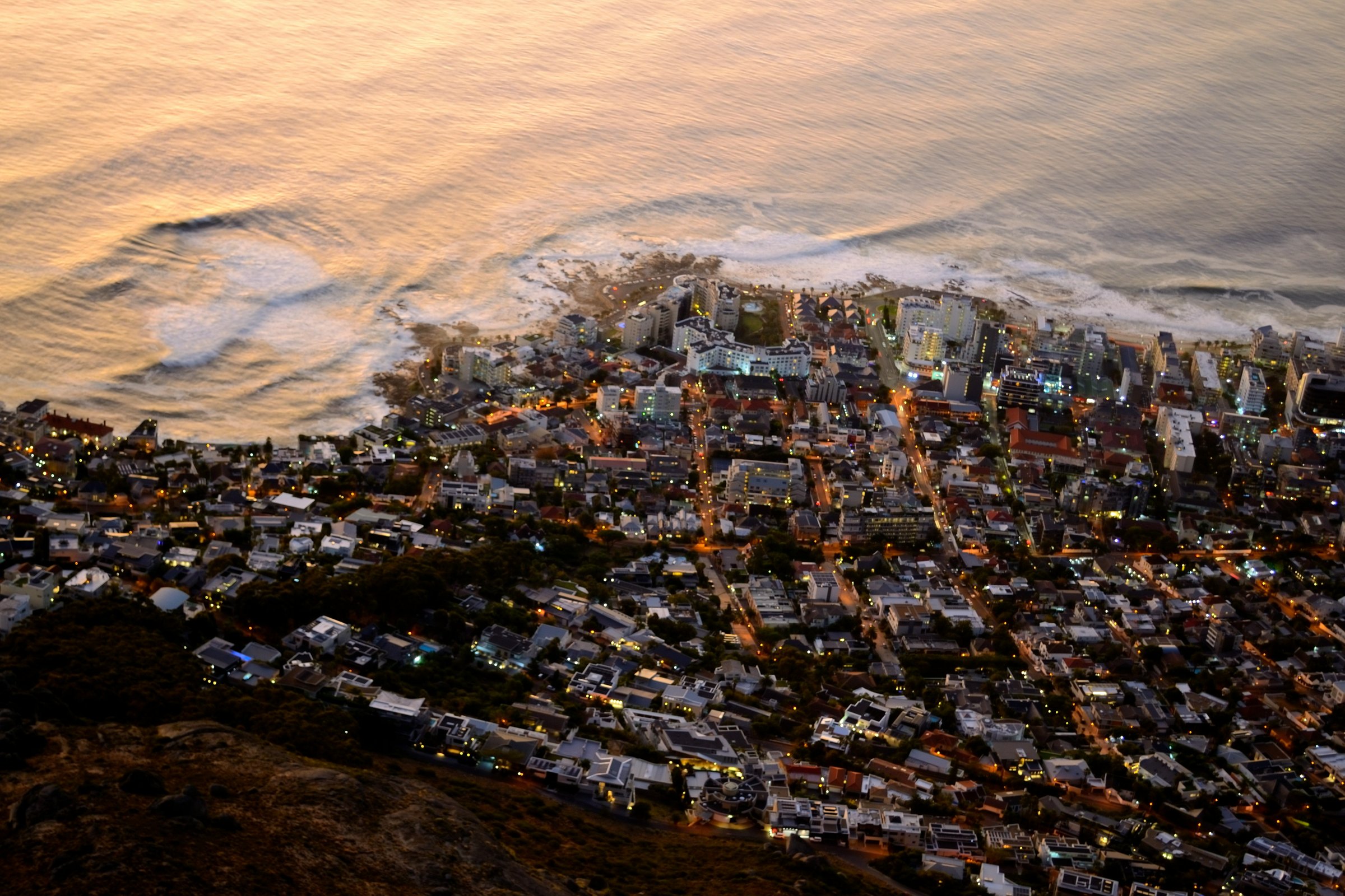 Cape Town cityscape at dusk with ocean light