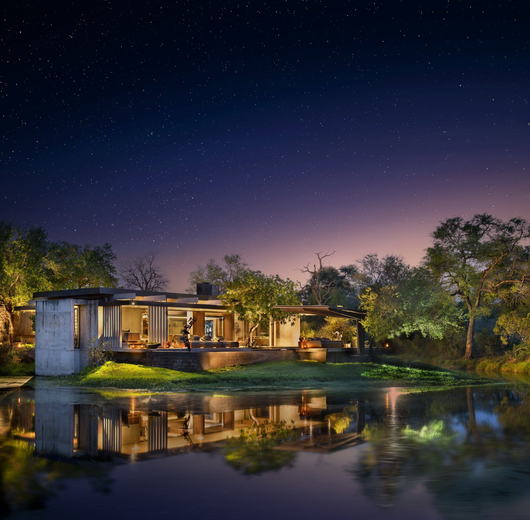 An illuminated contemporary safari suite beneath a star-filled sky