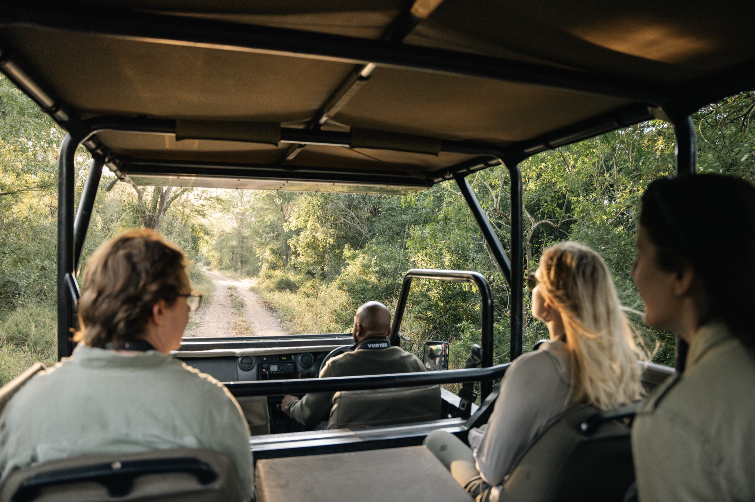 Guests on a guided safari drive in Gorongosa National Park, Mozambique.