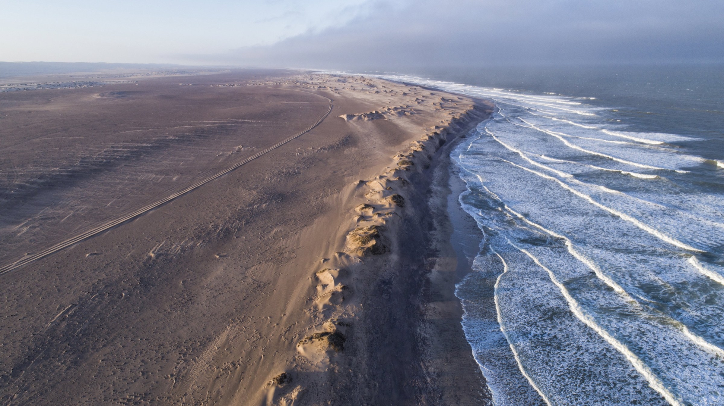 Aerial view of Namibia’s desert coastline meeting the Atlantic Ocean