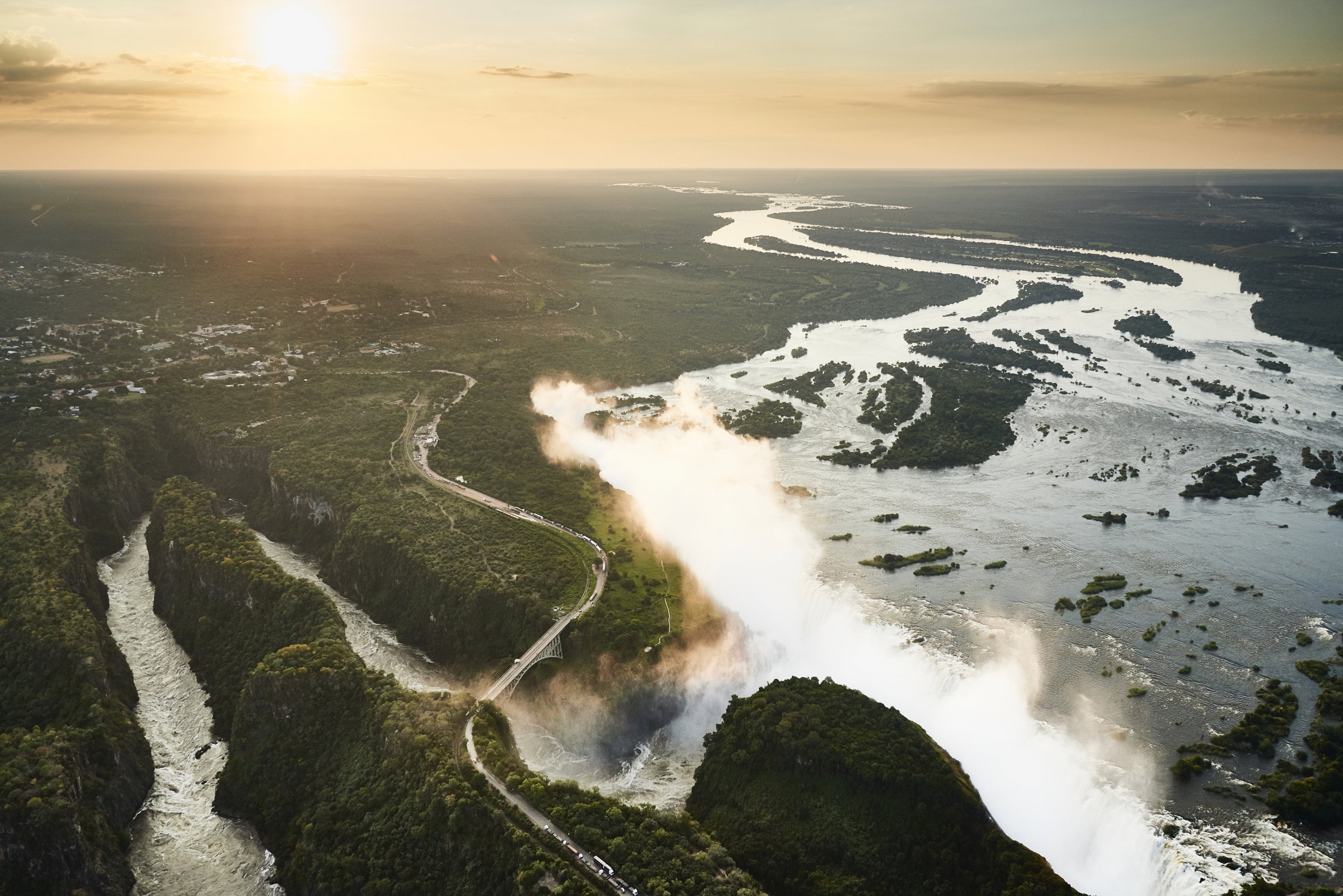 Aerial view of Victoria Falls, the Zambezi River and the bridge between Zimbabwe and Zambia