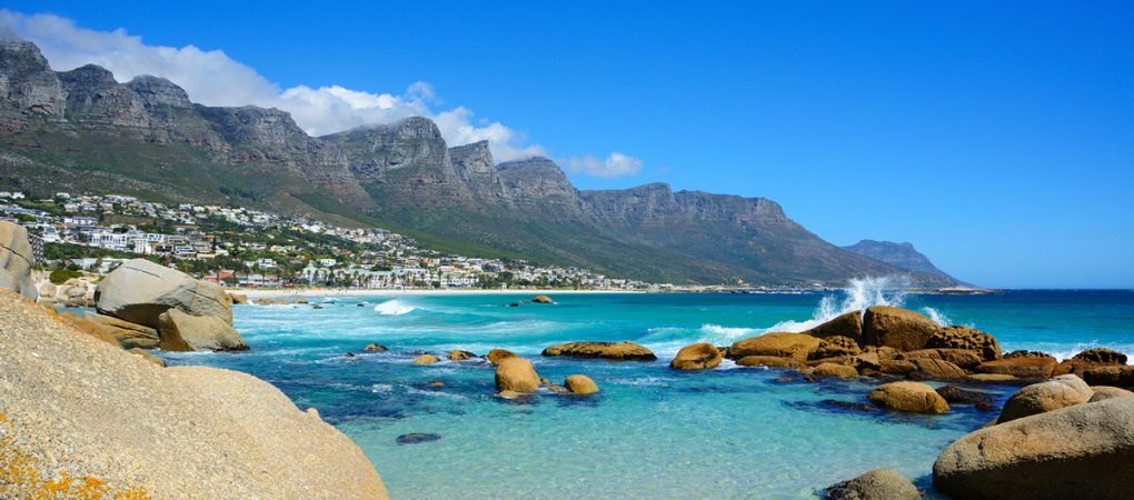 Cape Town’s Atlantic coastline, turquoise water and the Twelve Apostles mountains in South Africa