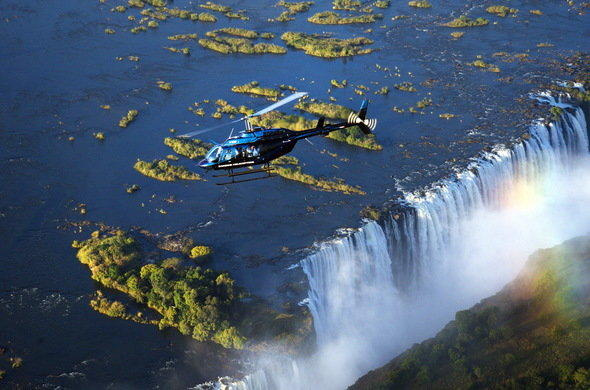 Helicopter flying above Victoria Falls